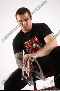 Alex Sitting With Pistol Pose 08